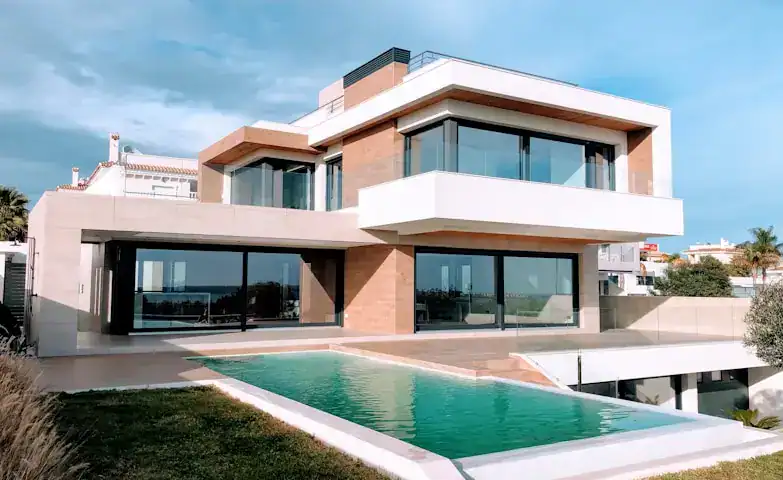 Luxury contemporary house with large glass windows and outdoor pool in Beverly Hills, NSW, Australia.