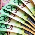 Close-up of multiple Australian $100 banknotes fanned out, symbolising wealth, savings, and financial growth opportunities.