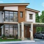 Contemporary two-storey house featuring large glass windows, wooden accents, a carport, and lush greenery in the background.