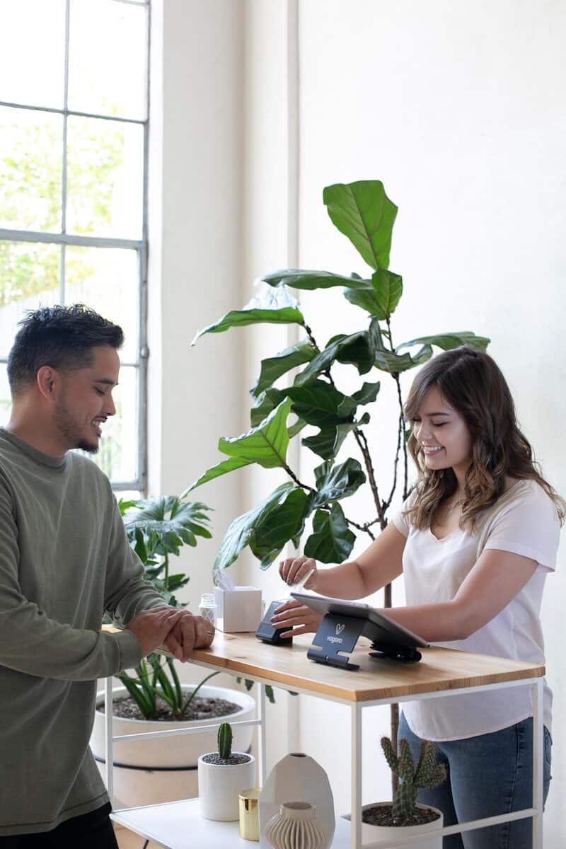 Accountant meeting a small business owner at a desk, representing accounting costs for small business in 2026