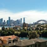 Sydney suburban houses with the Harbour Bridge and city skyline, representing property accountant services in Sydney