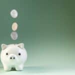 Piggy bank with a coin, representing setting up a self-managed super fund (SMSF) in Australia
