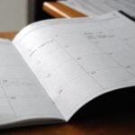 Open calendar on a desk, representing BAS due dates for the 2026-27 financial year