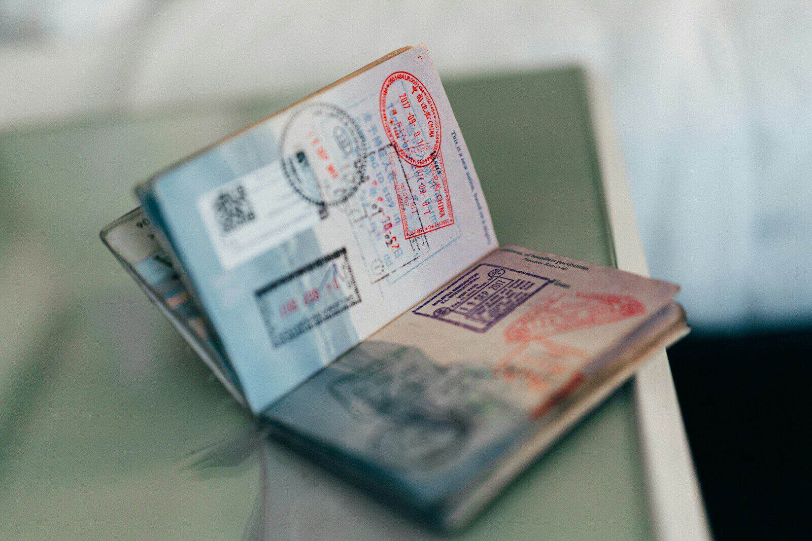 Passport with travel stamps, representing the tests for being an Australian resident for tax purposes